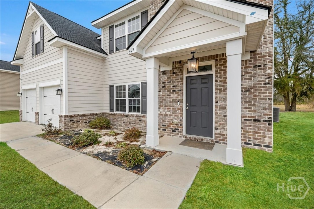 392 Akins Ranch Road Northeast Ludowici, GA 31316 - Photo 3 of 48 Grass is digitally enhanced.