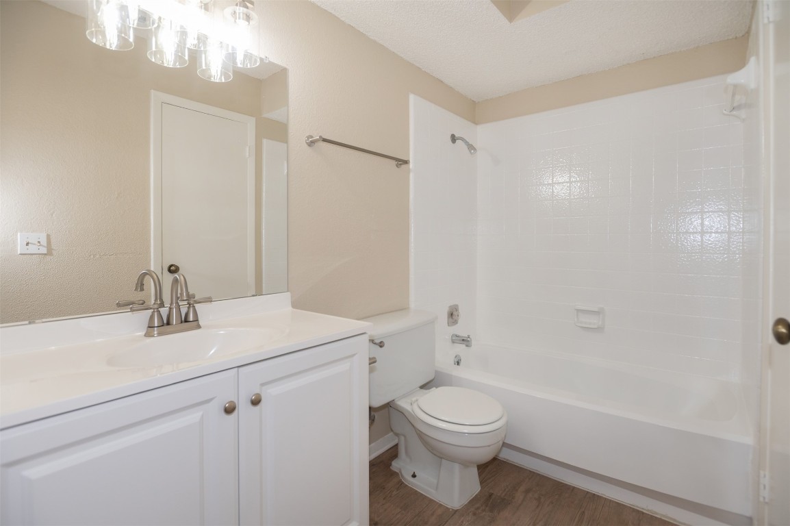 403 West Bowman Road, Unit A Round Rock, TX 78664 - Photo 11 of 17 a bathroom with a sink a toilet and shower