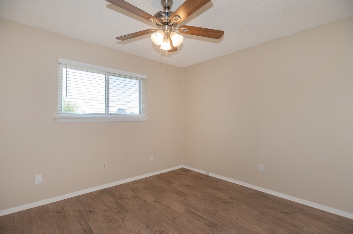403 West Bowman Road, Unit A Round Rock, TX 78664 - Photo 12 of 17 an empty room with a window and a fan