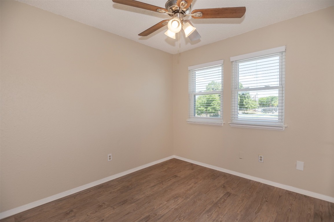 403 West Bowman Road, Unit A Round Rock, TX 78664 - Photo 14 of 17 an empty room with a window and a fan