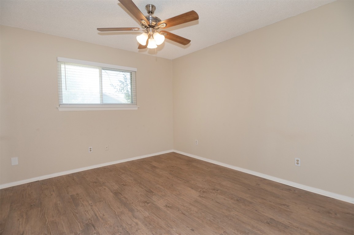 403 West Bowman Road, Unit A Round Rock, TX 78664 - Photo 10 of 17 an empty room with a window and a fan
