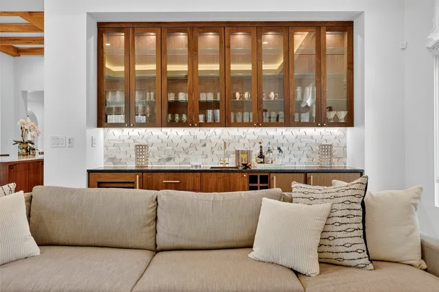 a living room with a couch and a large window