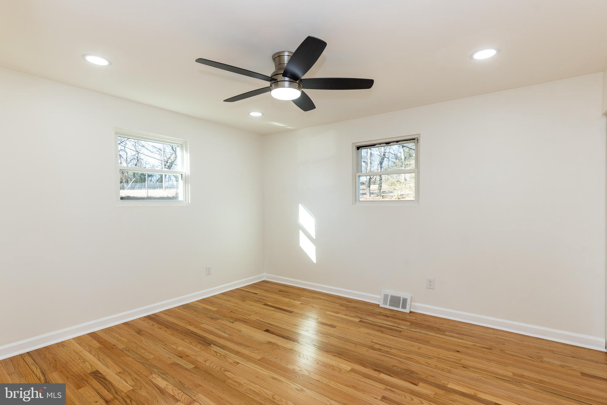 5510 Daybreak Terrace Baltimore, MD 21206 - Photo 27 of 43 a view of empty room with wooden floor and fan