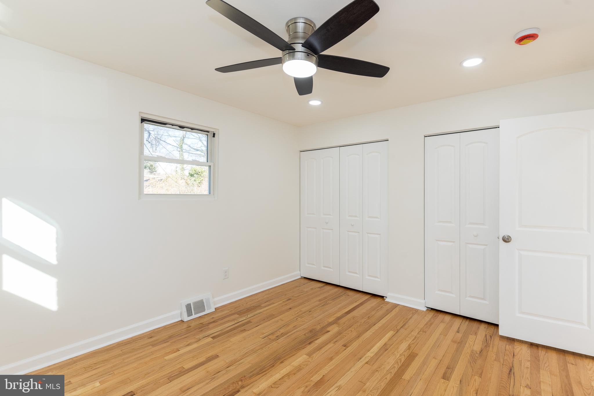 5510 Daybreak Terrace Baltimore, MD 21206 - Photo 29 of 43 wooden floor in an empty room with a window