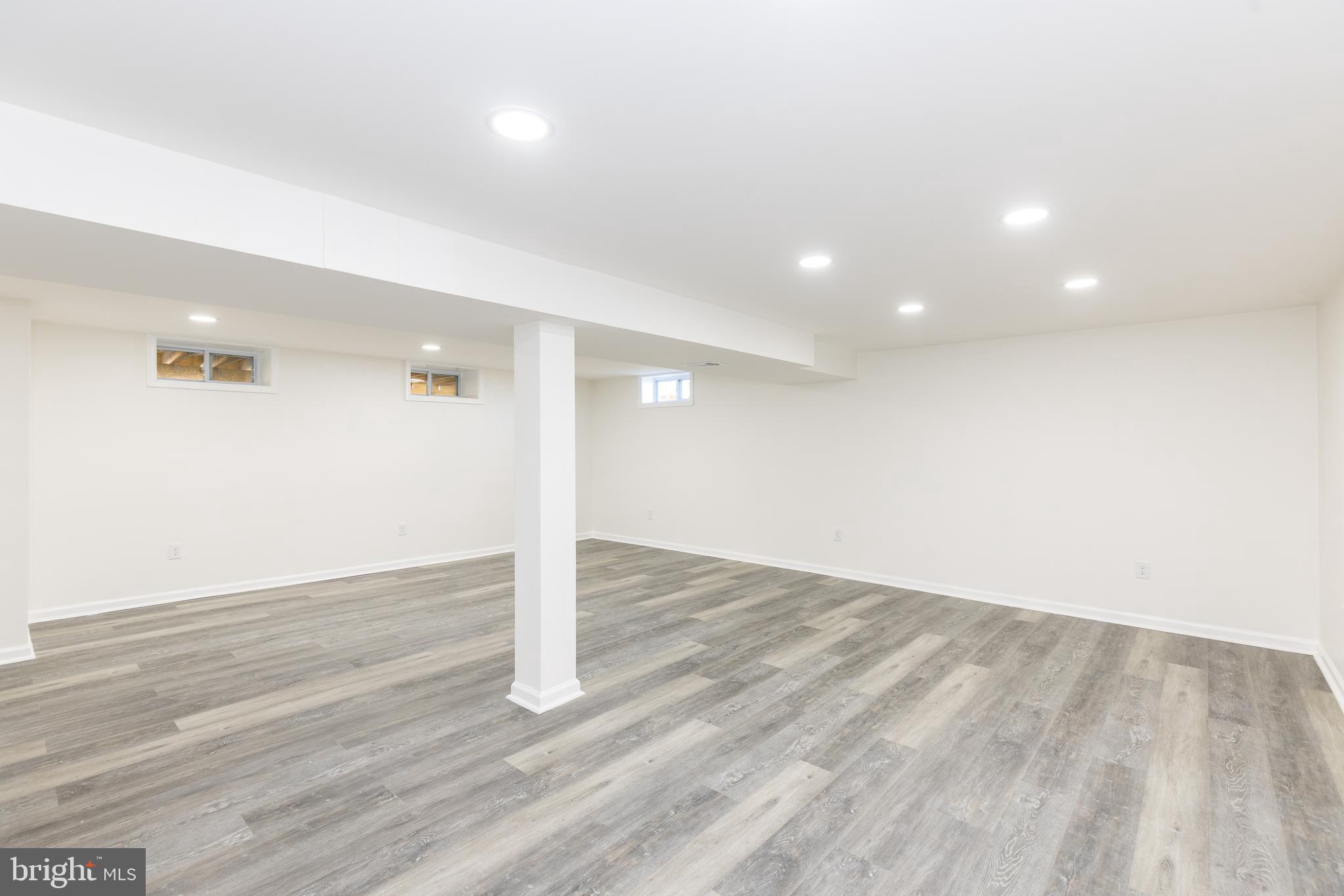 5510 Daybreak Terrace Baltimore, MD 21206 - Photo 31 of 43 an empty room with wooden floor and entrance