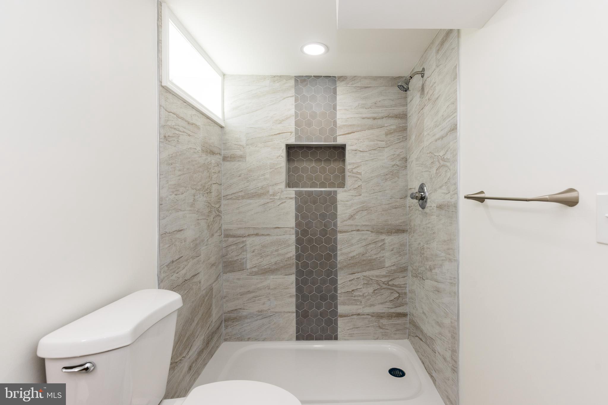 5510 Daybreak Terrace Baltimore, MD 21206 - Photo 37 of 43 a bathroom with a shower and toilet