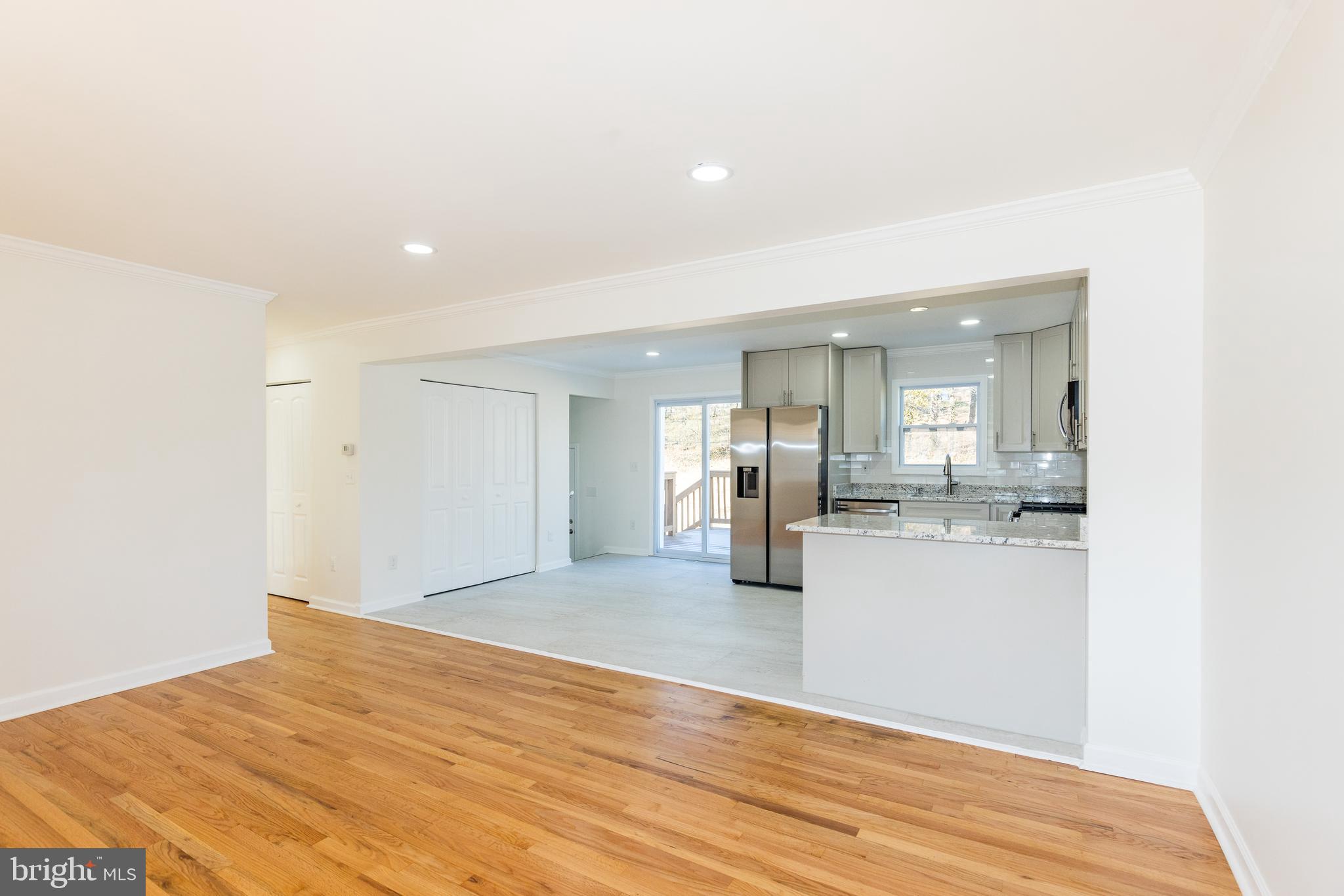 5510 Daybreak Terrace Baltimore, MD 21206 - Photo 4 of 43 a view of empty room with wooden floor