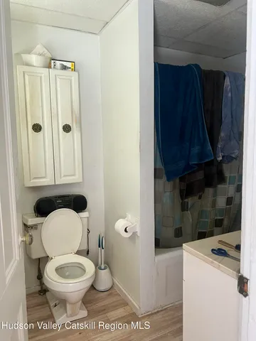 a bathroom with a toilet a sink and a shower