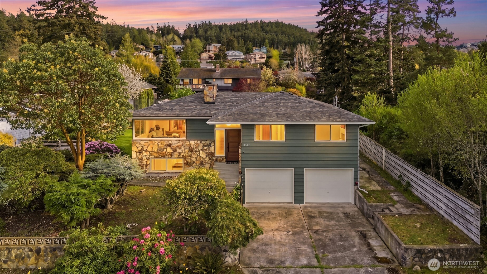 a aerial view of a house with a yard