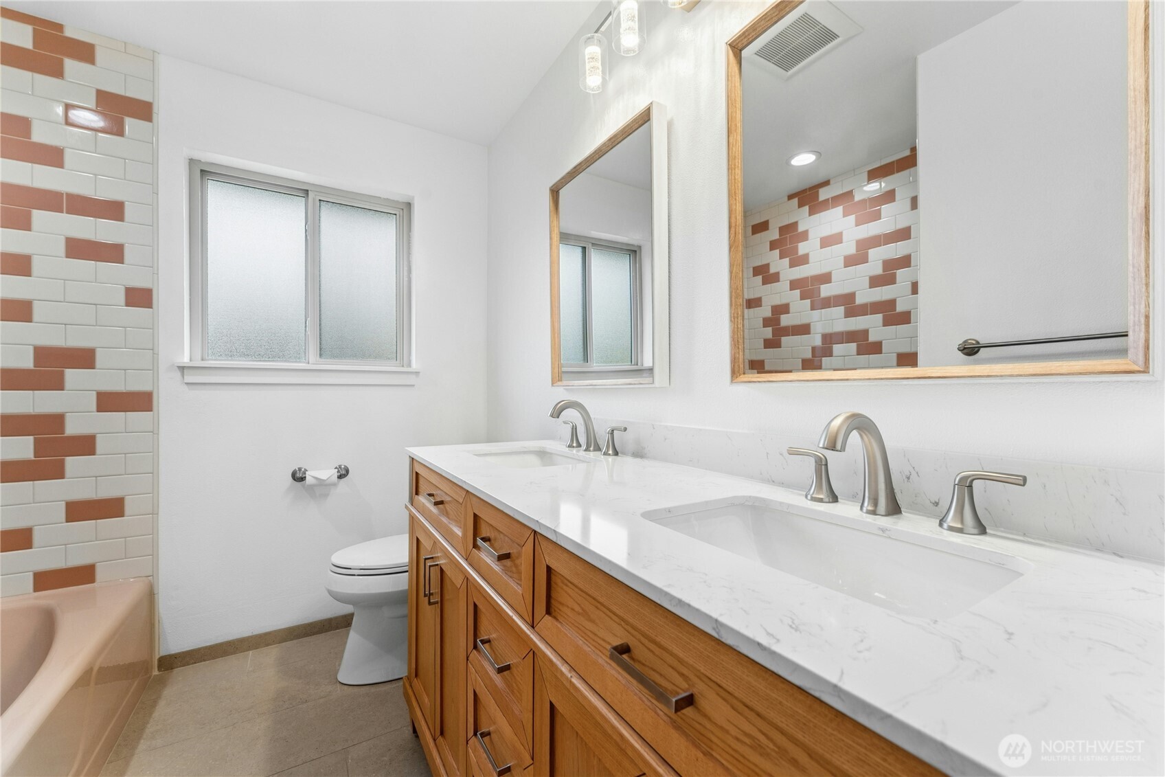 3501 West 3rd Street Anacortes, WA 98221 - Photo 14 of 28 a bathroom with a granite countertop sink mirror and toilet
