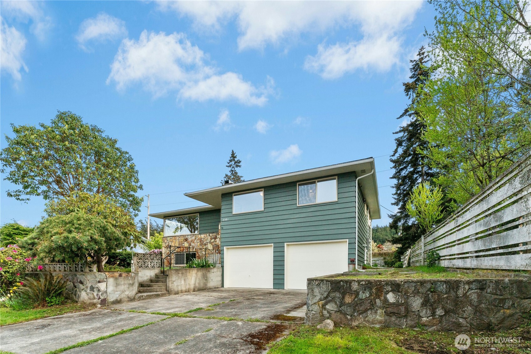 3501 West 3rd Street Anacortes, WA 98221 - Photo 2 of 28 a front view of a house with garden
