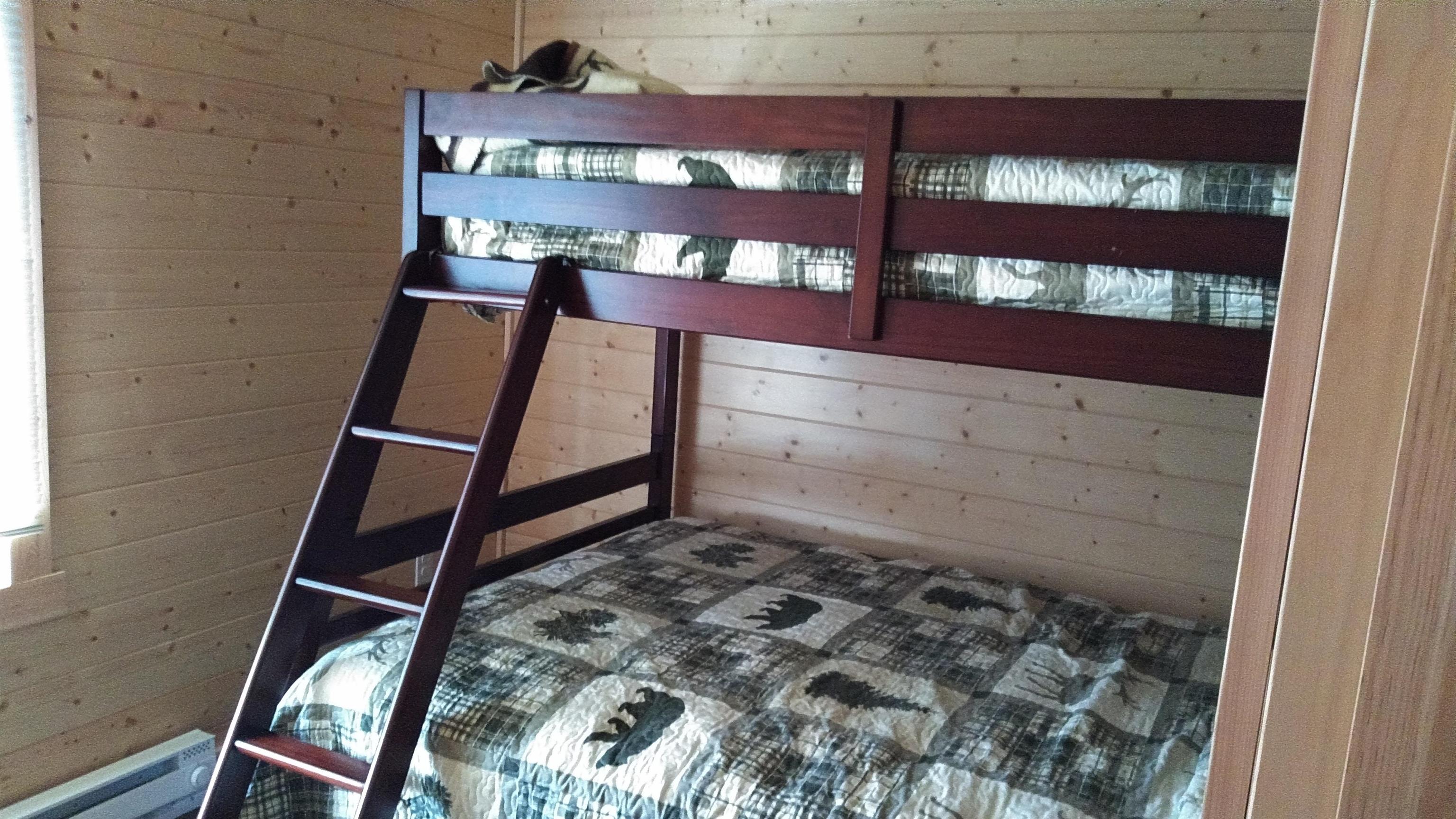 13496 Pine Road, Unit 10 Ely, MN 55731 - Photo 20 of 26 Unfurnished bedroom with wooden walls and a baseboard heating unit