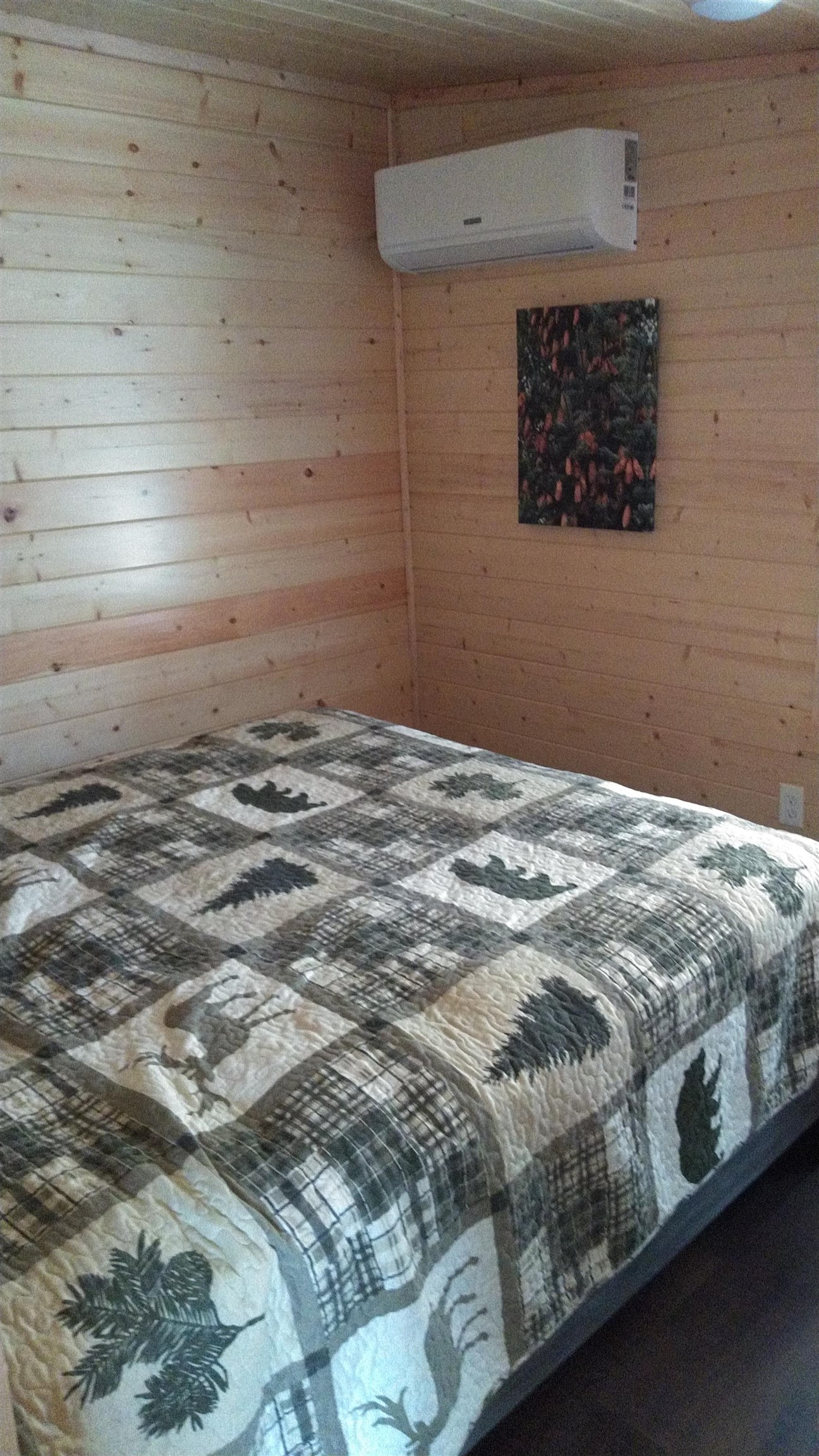 13496 Pine Road, Unit 10 Ely, MN 55731 - Photo 21 of 26 Bedroom with wooden walls and a wall unit AC