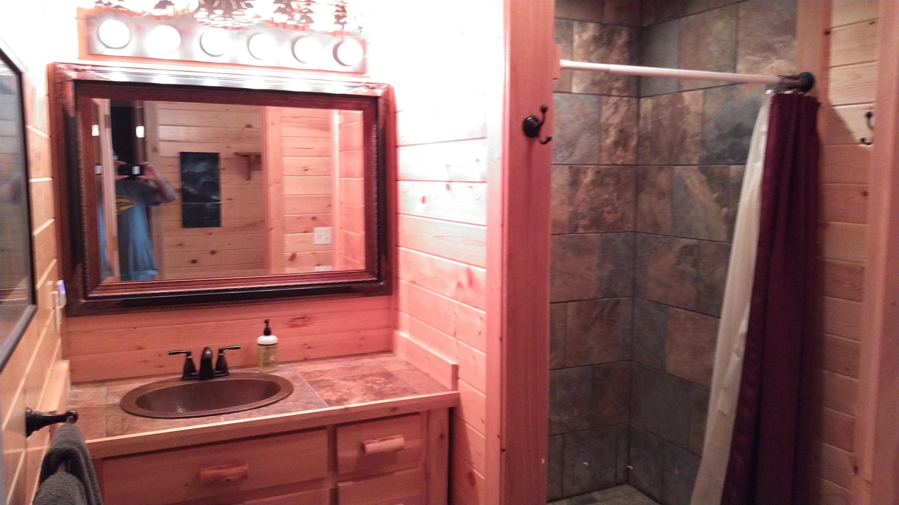 13496 Pine Road, Unit 10 Ely, MN 55731 - Photo 7 of 26 Bathroom with vanity and a shower stall