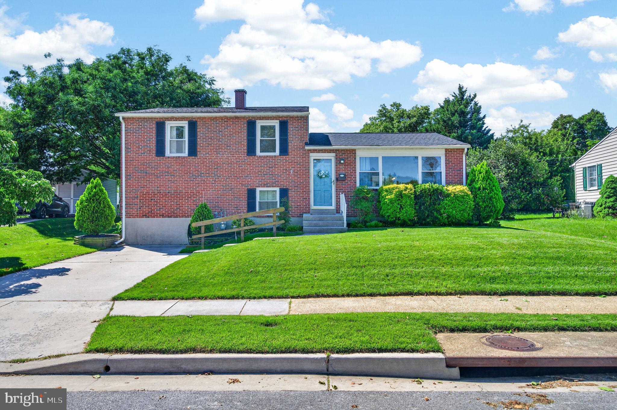 9 Haddington Road Lutherville-Timonium, MD 21093 - Photo 1 of 55 a front view of a house with a yard and garage
