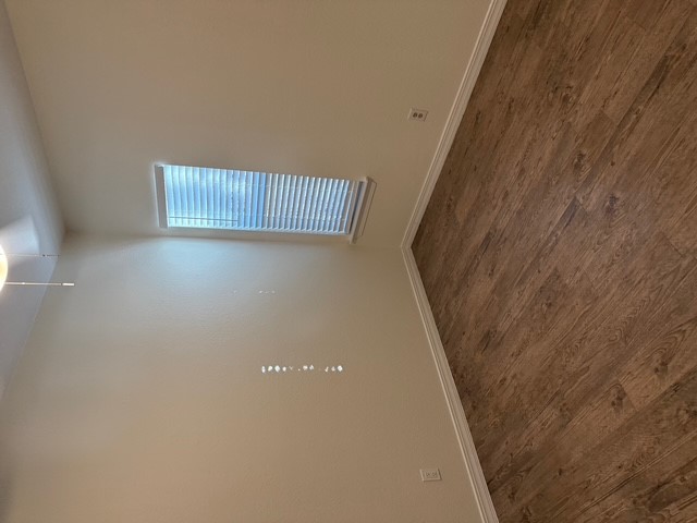 4409 Guadalupe Street, Unit 3 Austin, TX 78751 - Photo 12 of 18 an empty room with wooden floor and windows