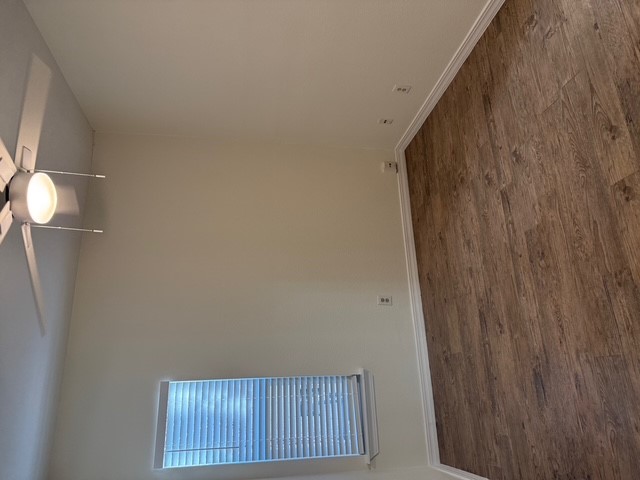 4409 Guadalupe Street, Unit 3 Austin, TX 78751 - Photo 13 of 18 a view of a room with wooden floor and fan