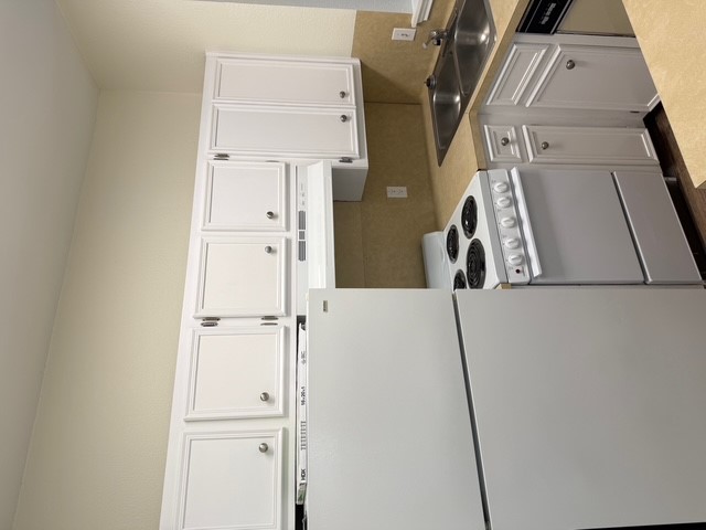 4409 Guadalupe Street, Unit 3 Austin, TX 78751 - Photo 6 of 18 a kitchen with granite countertop a sink and a refrigerator