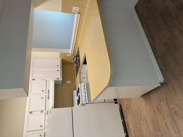 4409 Guadalupe Street, Unit 3 Austin, TX 78751 - Photo 7 of 18 a kitchen with stainless steel appliances a stove a sink and a refrigerator