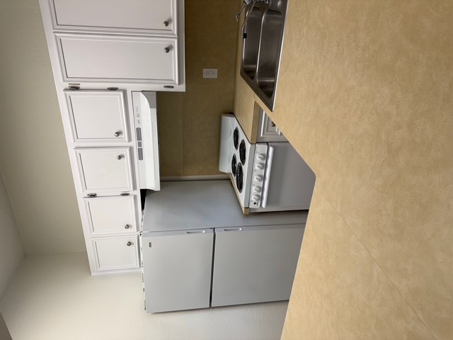 4409 Guadalupe Street, Unit 3 Austin, TX 78751 - Photo 10 of 18 a kitchen with stainless steel appliances a refrigerator sink and cabinets