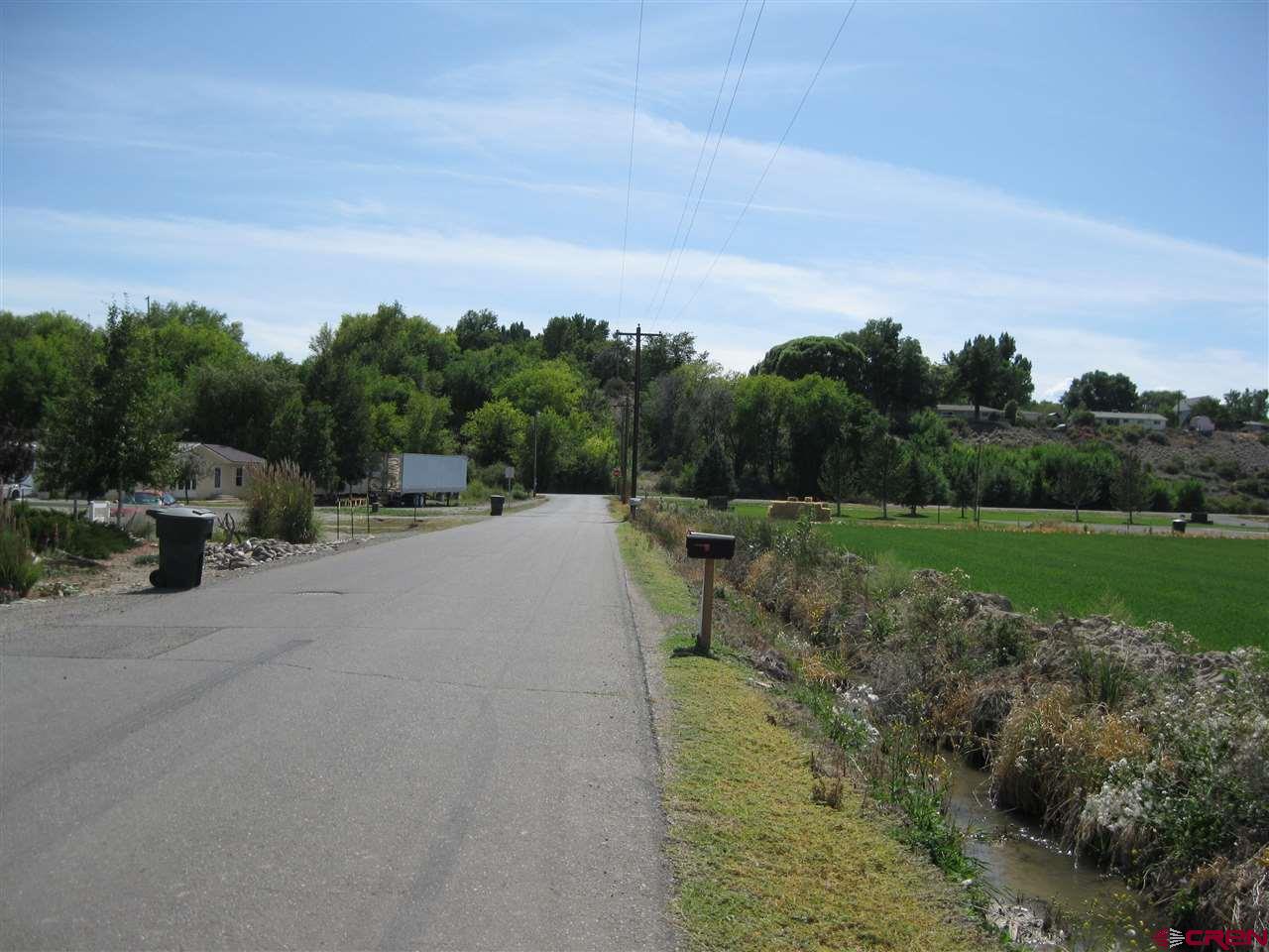 Tbd Tbd 1725th Road Delta, CO 81416 - Photo 3 of 13 a view of a road with a building in the background