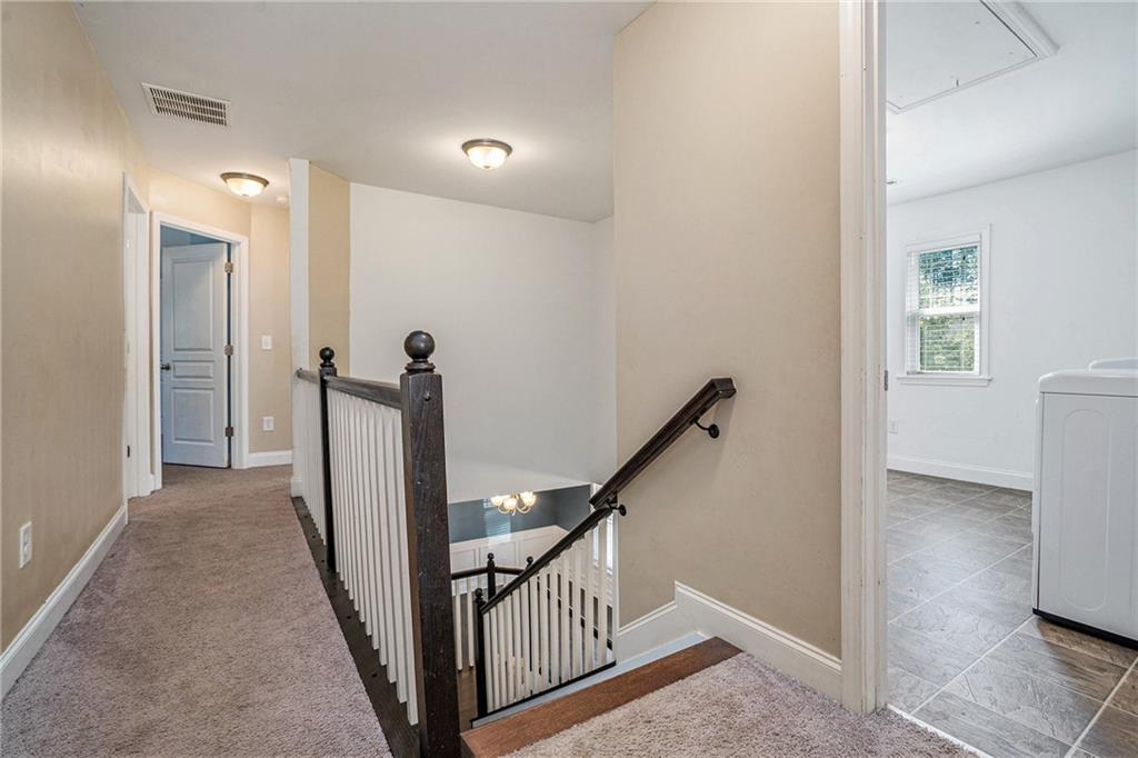 115 Floating Leaf Way Dallas, GA 30132 - Photo 15 of 47 a view of a hallway with a room and stairs