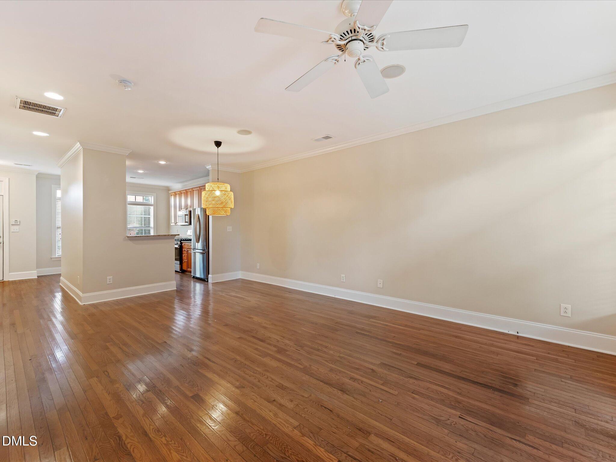 606 Highpark Lane Raleigh, NC 27608 - Photo 12 of 27 a view of an empty room with wooden floor