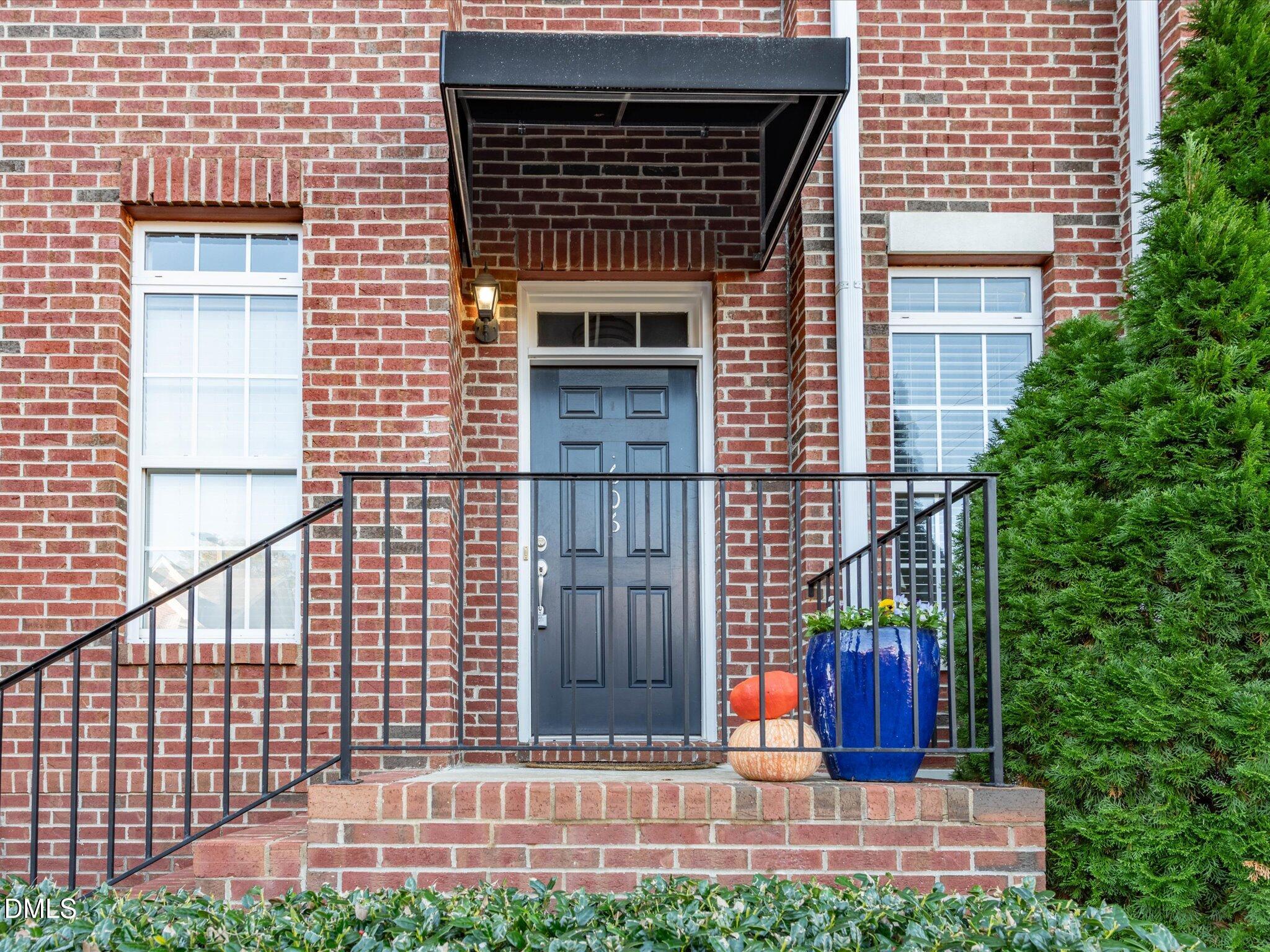 606 Highpark Lane Raleigh, NC 27608 - Photo 2 of 27 a view of a house with a small yard and wooden floor and fence