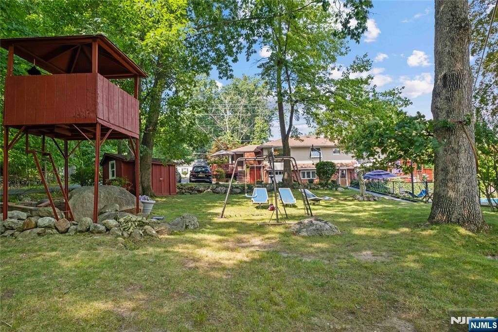 1468 Alps Road Wayne, NJ 07470 - Photo 27 of 36 a view of a house with a yard and sitting area
