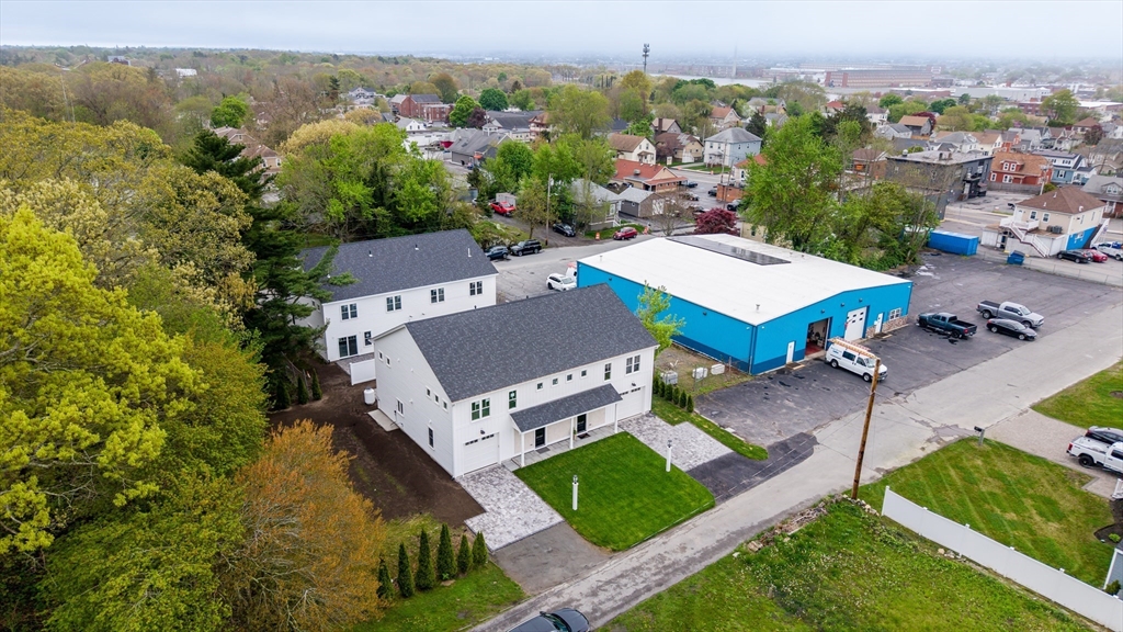 14 Hayes Street, Unit 1 Acushnet, MA 02743 - Photo 2 of 26 an aerial view of a house with a garden