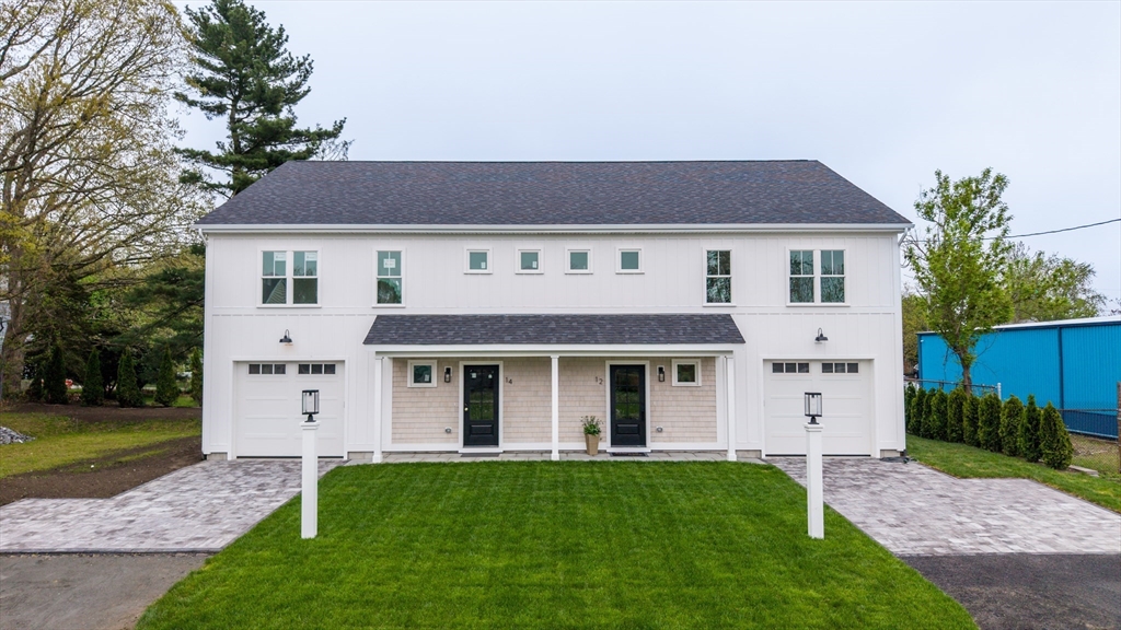 14 Hayes Street, Unit 1 Acushnet, MA 02743 - Photo 5 of 26 a front view of a house with a yard