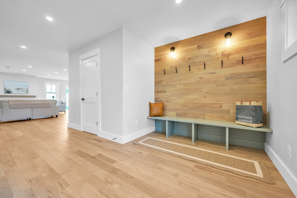 14 Hayes Street, Unit 1 Acushnet, MA 02743 - Photo 6 of 26 a view of a hallway with wooden floor and a large window