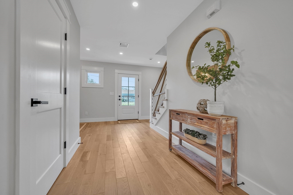 14 Hayes Street, Unit 1 Acushnet, MA 02743 - Photo 8 of 26 a room with furniture and a wooden floor