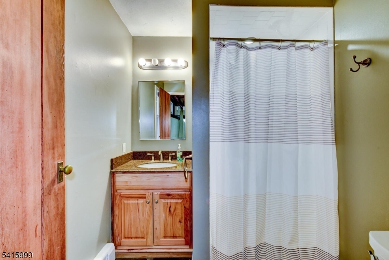 95 Dreahook Road Lebanon, NJ 08833 - Photo 13 of 30 a view of a bathroom with a sink and a mirror