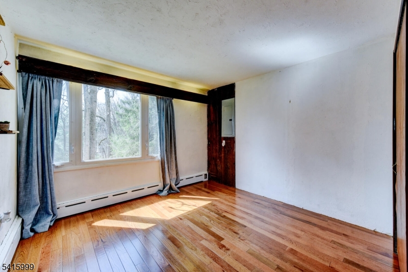95 Dreahook Road Lebanon, NJ 08833 - Photo 15 of 30 an empty room with wooden floor and a window