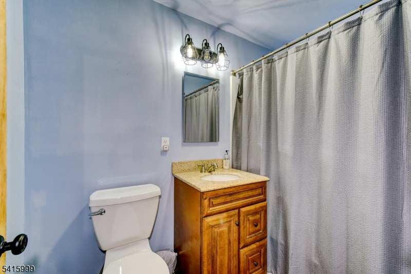 95 Dreahook Road Lebanon, NJ 08833 - Photo 16 of 30 a bathroom with a toilet sink and mirror