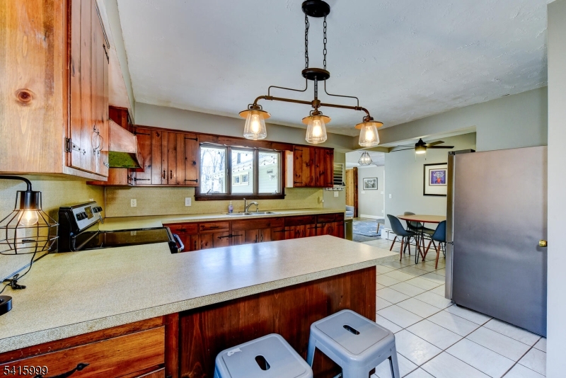 95 Dreahook Road Lebanon, NJ 08833 - Photo 8 of 30 a kitchen with stainless steel appliances granite countertop a sink a counter space and cabinets
