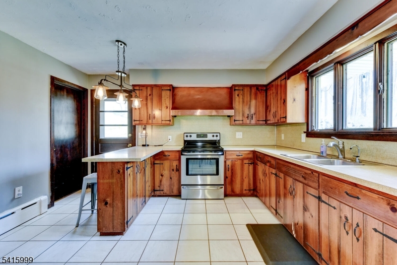 95 Dreahook Road Lebanon, NJ 08833 - Photo 10 of 30 a kitchen with stainless steel appliances granite countertop a stove a sink dishwasher and a refrigerator