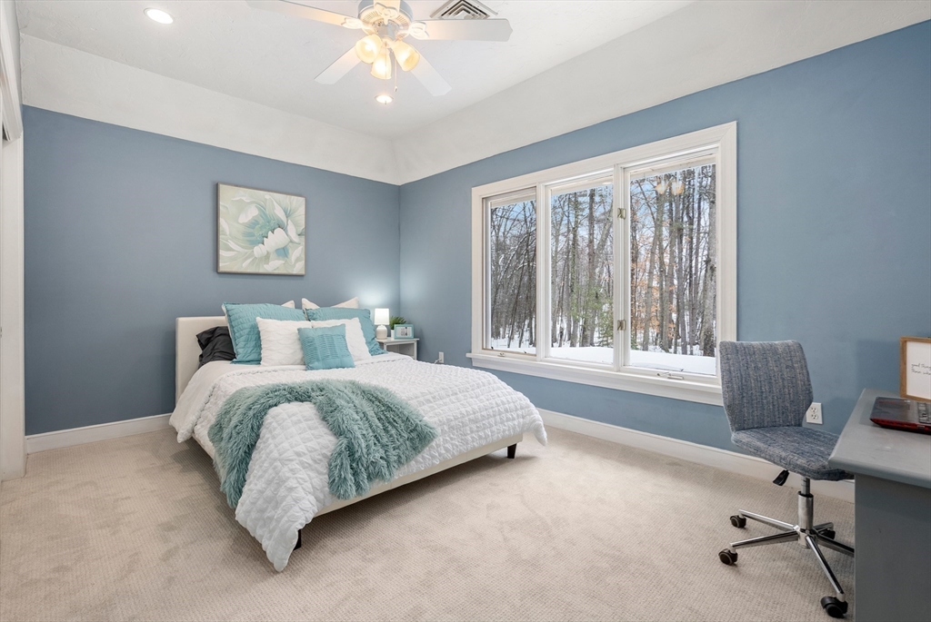 84 Phillips Road Sudbury, MA 01776 - Photo 18 of 34 a bedroom with a bed and a desk