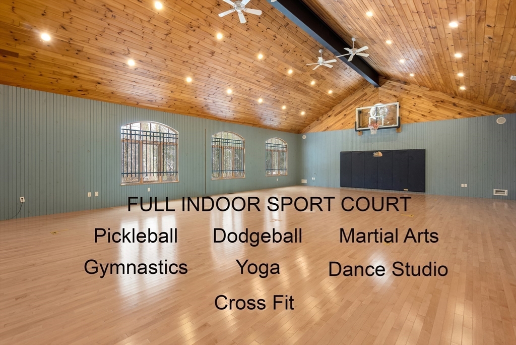 84 Phillips Road Sudbury, MA 01776 - Photo 24 of 34 a view of a hall with a wooden floor