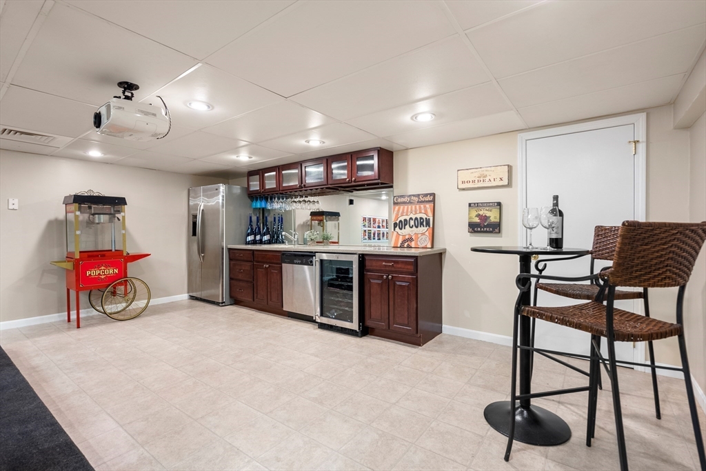 84 Phillips Road Sudbury, MA 01776 - Photo 29 of 34 a view of a room with gaming equipment and windows