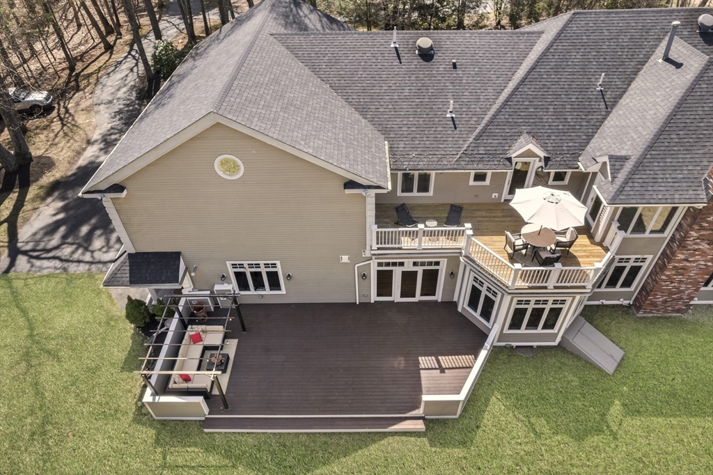 84 Phillips Road Sudbury, MA 01776 - Photo 32 of 34 an aerial view of a house with swimming pool