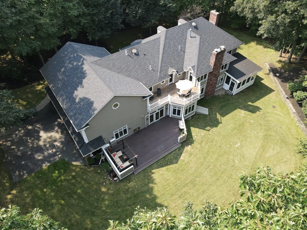 84 Phillips Road Sudbury, MA 01776 - Photo 33 of 34 an aerial view of a house with a yard and balcony