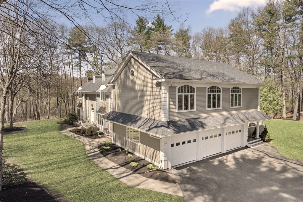 84 Phillips Road Sudbury, MA 01776 - Photo 34 of 34 a view of a house with a yard