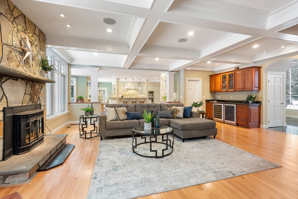 84 Phillips Road Sudbury, MA 01776 - Photo 4 of 34 a living room with fireplace furniture and a wooden floor