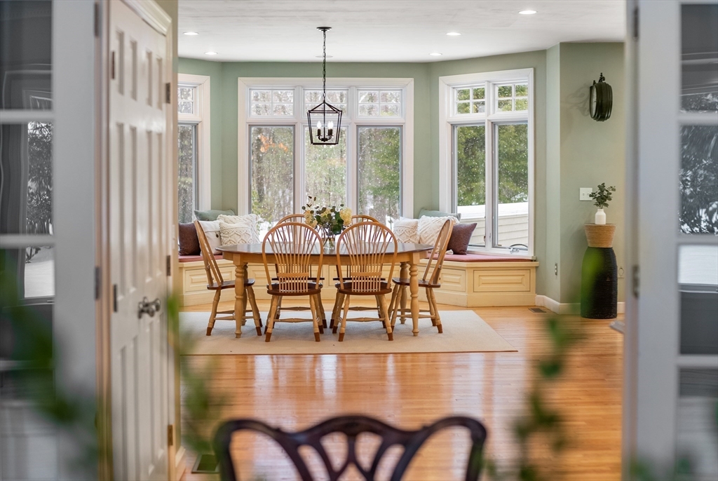 84 Phillips Road Sudbury, MA 01776 - Photo 8 of 34 a view of a dining room with furniture wooden floor and chandelier