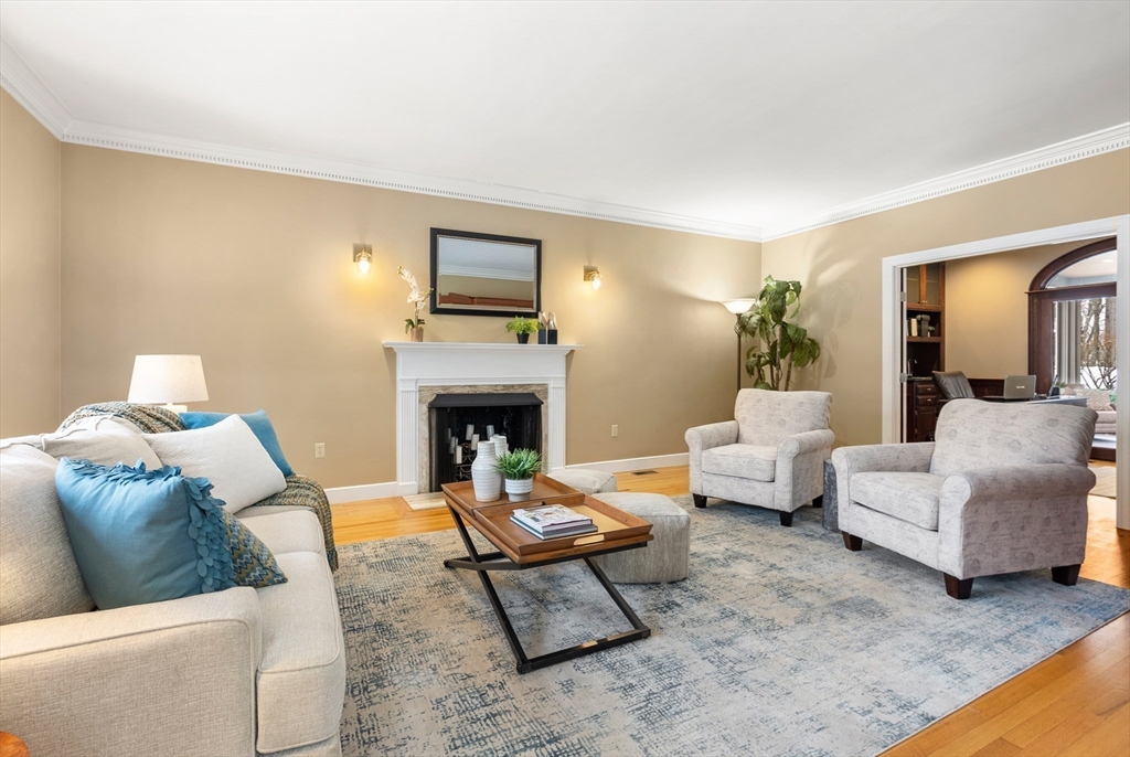 84 Phillips Road Sudbury, MA 01776 - Photo 9 of 34 a living room with furniture and a fireplace