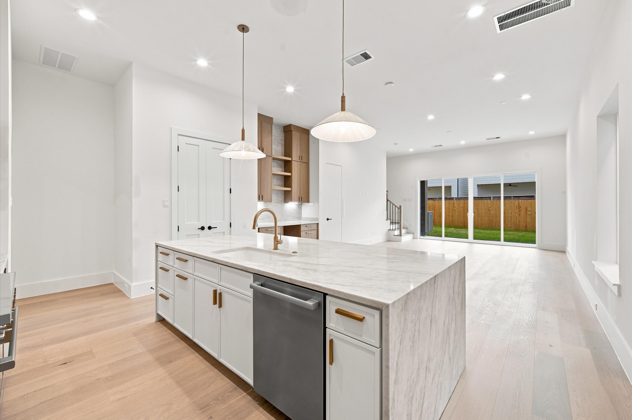112 East 27th Street Houston, TX 77008 - Photo 9 of 43 Open-concept layout connecting the kitchen, dining and living areas.