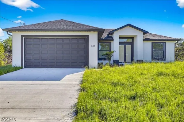 a front view of a house with yard