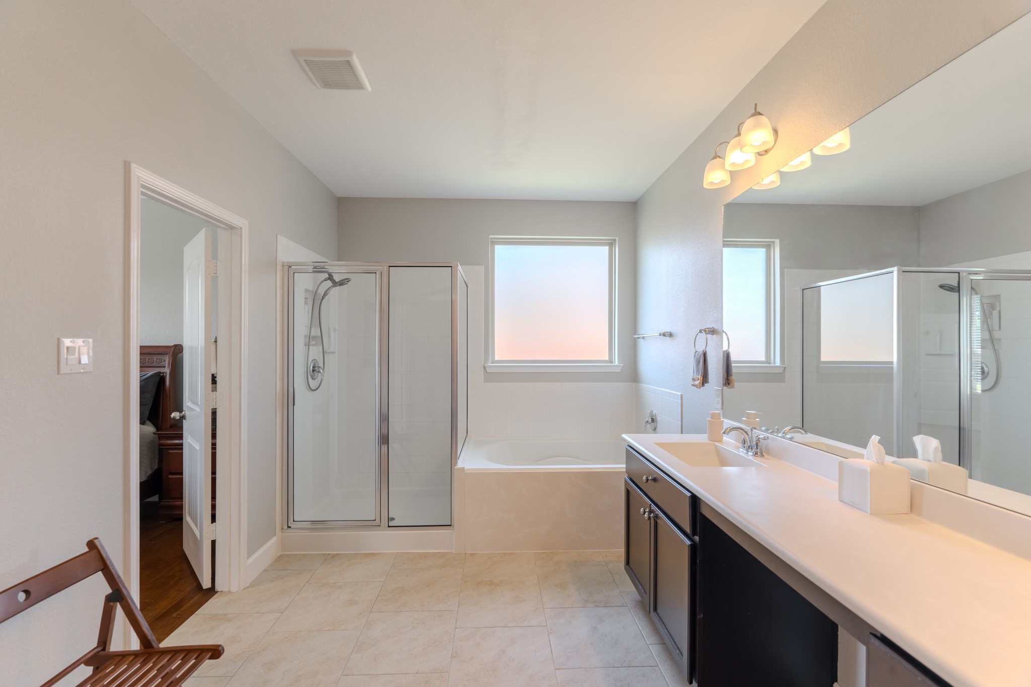 24322 North Newcastle Bay Trail Spring, TX 77389 - Photo 30 of 50 a spacious bathroom with a double vanity sink a mirror and a shower